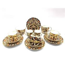 Early 20th century Royal Crown Derby Imari pattern no. 1128 tea set comprising six trios, sugar bowl and milk jug