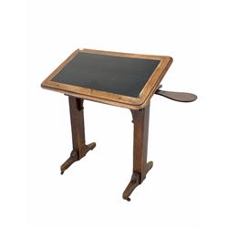 Victorian mahogany clerks writing table, the skivered top being angle adjustable, raised on square section supports with sledge feet and castors W87cm