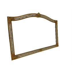 Deknudt Mirrors - Gilt cushion framed wall mirror, arched top with central stylised fleur-de-lis decoration and cartouche corners