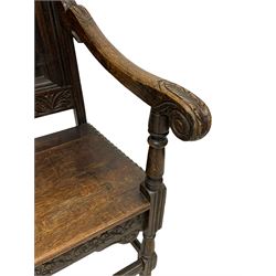 19th century heavily carved oak Wainscot chair, scroll carved pediment over lunette carved frieze, panelled back with carved mount depicting figures at wall, down sweeping arms with acanthus carved terminals, on turned supports united by moulded stretchers