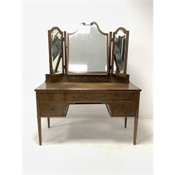 Early 20th century dressing table, the back with uprights inlaid with mother of pearl trailing harebells supporting three bevelled swing mirrors, one long and four short drawers under, raised on square tapered supports 