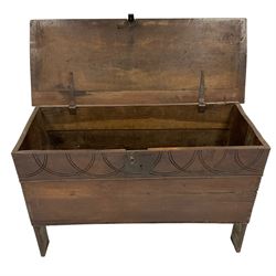 18th century oak coffer or chest, rectangular hinged top with moulded edge, the frieze carved with interlacing lunettes, raised on stile supports 