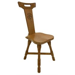 'Beaverman' oak hall chair, cresting rail with pierced handle over back carved with Yorkshire Rose, dished seat, the edge carved with beaver signature, on four splayed octagonal supports joined by x-framed stretchers, by Colin Almack of Sutton-under-Whitestonecliffe