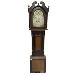 An early nineteenth century longcase clock, c1820, in an oak and mahogany veneered case with a swan’s neck pediment and recessed break arch door flanked by matching pilasters with brass capitals, the trunk with recessed and reeded quarter columns and brass capitals, short oak door with crossbanding and a pointed top, square mahogany plinth with a contrasting oak panel, 12” wide painted dial with upright Arabic’s and minute track, spandrels painted with matching bouquets of flowers and a painted depiction of a cottage encircled with flowers to the arch, subsidiary seconds dial and semi-circular calendar aperture with a date disc behind, matching stamped brass hands and seconds hand, dial pinned to the movement via a Walker and Hughes falseplate, eight-day weight driven movement with a rack striking recoil anchor escapement sounding the hours on a cast bell.
With weights and key, no pendulum.  
