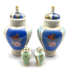 Pair of Continental Helena Wolfsohn style vases and covers H29cm together with a pair of similar style miniature jars and covers, unmarked (4)