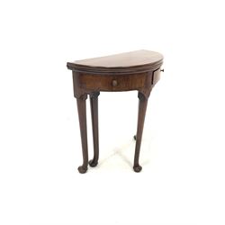 George II mahogany demi lune tea table, with two drawers, raised on turned supports with pad feet 