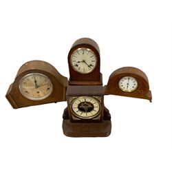 Four wooden cased mantle clocks