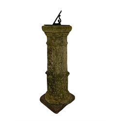 Antique cast sundial with Roman numerals, raised on fluted column pedestal in the Doric style