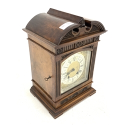 Late 19th century mantle clock in architectural walnut case, arched pediment with central leaf carved motif, enclosed by bevel glazed door, fluted and lunette carved, moulded base, brass dial decorated with floral scroll mounts, silvered Roman and Arabic chapter ring, twin train driven movement by 'Lenzkirch', stamped 'AUG 1 Million, 358398', striking the hours and half on single coil, with pendulum and key, H33cm, W22cm