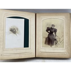 Leather photograph album and contents including military portrait by J Raucher, Swaziland, North West Frontier 1920, portraits by Avison, York etc