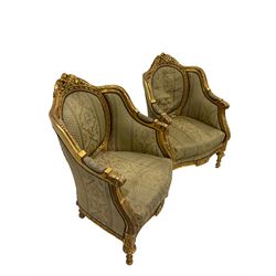 Pair Louis XVI design gilt framed armchairs, the cresting rail pierced and moulded with flower heads, central back panel framed with gilt ribbon design, scrolled arm terminals decorated with acanthus leaves, the apron with flower heads and rosettes raised on turned tapering supports, upholstered in foliate patterned laurel green fabric with sprung seat