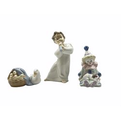Three Lladro figures comprising 'Pierrot with Puppy' 5277, 'Angel with Flute' 4540 and 'Duckling' 4895, two with original boxes, one with matching box (3)