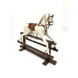 Early 20th century white painted rocking horse, on pine treadle base, L132cm