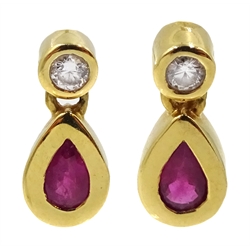 Pair of 18ct gold pear shaped ruby and diamond pendant earrings, hallmarked  