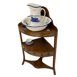George III mahogany three-tier corner washstand, shaped raised back over bowl and twin beaker rests, fitted with single drawer with two flanking faux drawers, with ceramic bowl and jug