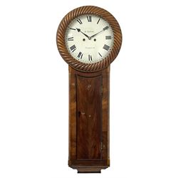 William Shildrake of Norwich – mahogany 8-day striking wall clock c1850, with a long trunk and concave topped trunk door, circular wooden bezel with rope-twist carving and stepped base, painted dial with makers name, Roman numerals and minute track with matching heart shaped steel hands, dial pined via a cast Finmore falseplate to a rack striking movement with a recoil anchor escapement. With weights and pendulum.  
William Shildrake is recorded as working from London Street, Norwich 1822-64. 
