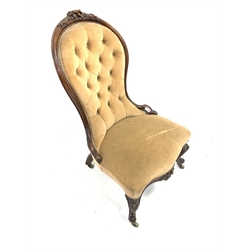 Victorian spoon back chair, with floral carved cresting rail over deep buttoned upholstered back, raised on floral carved and scrolled cabriole supports terminating in castors, W54cm 