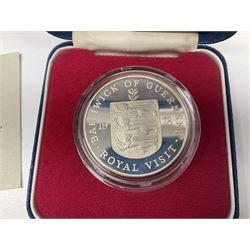 Queen Elizabeth II Bailiwick of Guernsey 1978 silver twenty five pence coin cased with certificate, Great British pre-decimal pennies and various 'Spade Guinea' type base metal gaming tokens, housed in a vintage cash tin 