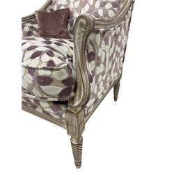French design hardwood framed armchair, moulded frame with down sweeping arms on S-scroll carved arm supports, upholstered in trailing foliage design in shades of lilac and purple, twist-turned front feet, with small complementary scatter cushion 