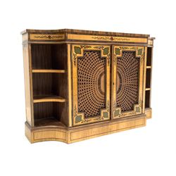 20th century Regency design satinwood side cabinet, the top with rosewood bands and ebonised string inlay over frieze with hand painted design, two geometric panelled cupboards with bergere fronts enclosing one shelf, flanked by four shelves to the canted fluted corners, raised on plinth base W124cm, H81cm, D35cm