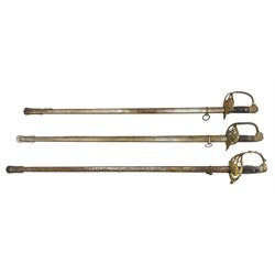 Spanish officers dress sword with Toledo blade, gilt basket hilt and chequered grip, blade length 78cm and two others (3)
