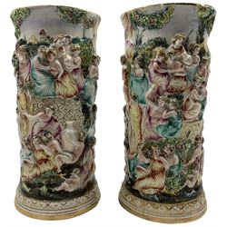 Pair of Capodimonte vases, relief decorated with a continuous figural Classical scene H36.5cm