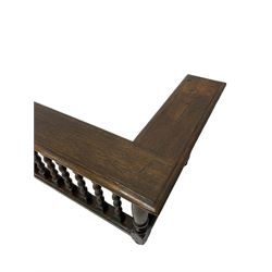 Late 19th century oak fire fender, the moulded rectangular top on a balustrade of bobbin turned supports, moulded lower rail, on turned feet