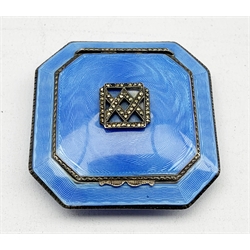 Silver and blue enamel compact, cushion shape and of octagonal design, the hinged cover with marcasite panel, gilded and mirrored interior, import marks for London 1929 Stockwell & Co 5.5cm