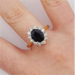 18ct gold oval sapphire and round brilliant cut diamond cluster ring, hallmarked, total diamond weight approx 0.55 carat, sapphire approx 2.60 carat