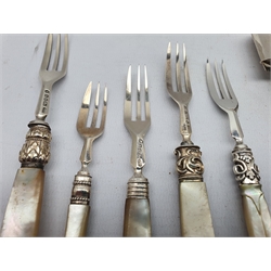 George III silver cheese scoop with later mother of pearl handle Birmingham 1810 Maker Samuel Pemberton, five various silver dessert forks with mother of pearl handles and three silver butter knives with mother of pearl handles