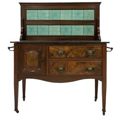 Late Victorian walnut washstand, the tiled back over black marble top, fitted with cupboard and drawers, square tapering supports with castors