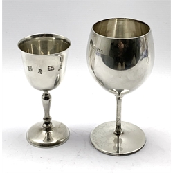 Silver chalice shape cup on a slender stem and circular foot H16cm Birmingham 1930 Maker Barker Bros. and another silver pedestal cup H14cm 12oz