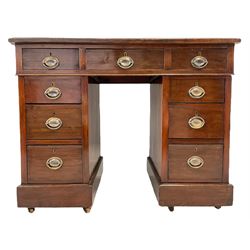 Late Victorian walnut twin pedestal desk, rectangular top with inset leather writing surface, fitted with nine graduating drawers, on castors