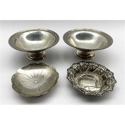Pair of Edwardian silver circular sweetmeat dishes with bead edge decoration initialled 'A' on pedestal foot D11cm Sheffield 1908 Maker James Dixon & Sons another sweetmeat dish and a saucer dish by Roberts & Belk 8.5oz 