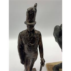 20th century planished bronze model of a Cavalry Officer, H28cm, together with two spelter figures figures (2)