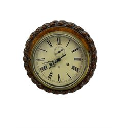 Circular carved oak wall clock with a quartz movement 