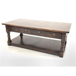 20th century oak two tier coffee table with two drawers, raised on turned supports united by under tier 61cm x 122cm, H48cm