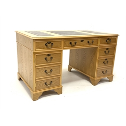 LE-AL Furniture of Manchester 20th century light oak twin pedestal desk with triple inset leather top, fitted with six drawer and single cupboard, W137cm, D77cm, H77cm