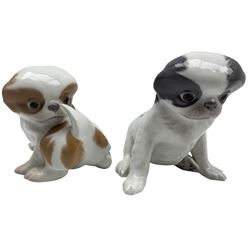 Royal Copenhagen model of a Pekingese dog in grey No. 448 together with another No. 445, both modelled by Erik Nielsen H14cm