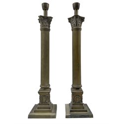 Pair of Corinthian column table lamps, moulded capitals above reeded columns on square stepped bases with applied laurel wreath decoration, H62cm overall 