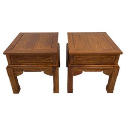 Pair Chinese Imperial style hardwood lamp or side tables, panelled square form, carved with foliate motifs and trailing geometric patterns, on square supports