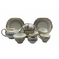 New Chelsea tea set decorated with trailing leave within a gilt band comprising seven cups, six saucers, six large plates, two bread and butter plates, tea pot, milk jug and sugar bowl (24)