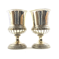 Pair of George III silver goblets, the campana shape bowls with half fluted base on a circular foot H13cm London 1814 Maker Thomas Radcliffe 14oz
