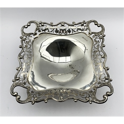 Square silver fruit dish with a pierced floral and scroll border on a pedestal foot 20cm square Sheffield 1912 Maker Elkington & Co. 15oz
