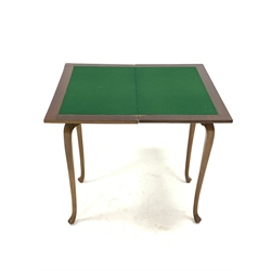 20th century walnut games table, with fold over revolving top revealing baize lined playing surface, raised on cabriole supports, W69cm