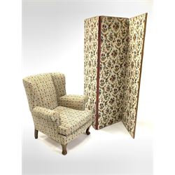 20th century wing back armchair, with squab cushion, upholstered in floral fabric, raised on shaped oak supports (W84cm) together with a 20th century bi fold privacy screen (H177cm)