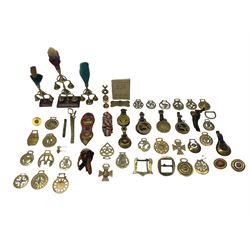 Various horse brasses including inverted crescents, hearts, animals, Diamond 1897 Jubilee and other accessories including a hame plate, terrets on stands, rope etc, together with 'All About Horse Brasses' by H.S. Richards 