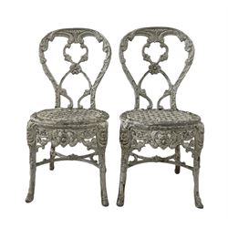Pair of aluminium garden chairs with all over floral design, together with a circular aluminium table  