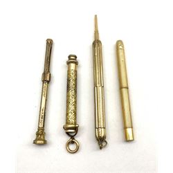 19th/ early 20th century propelling pencils to include an engraved example with amber glass matrix, two with engine turned design and another (4)
