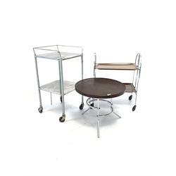 Mid 20th century industrial aluminium and chrome two tier trolley on castors (H92cm) together with another chrome two tier trolley, with folding wood effect trays (H81cm) and a lamp table with aluminium base (D60cm)